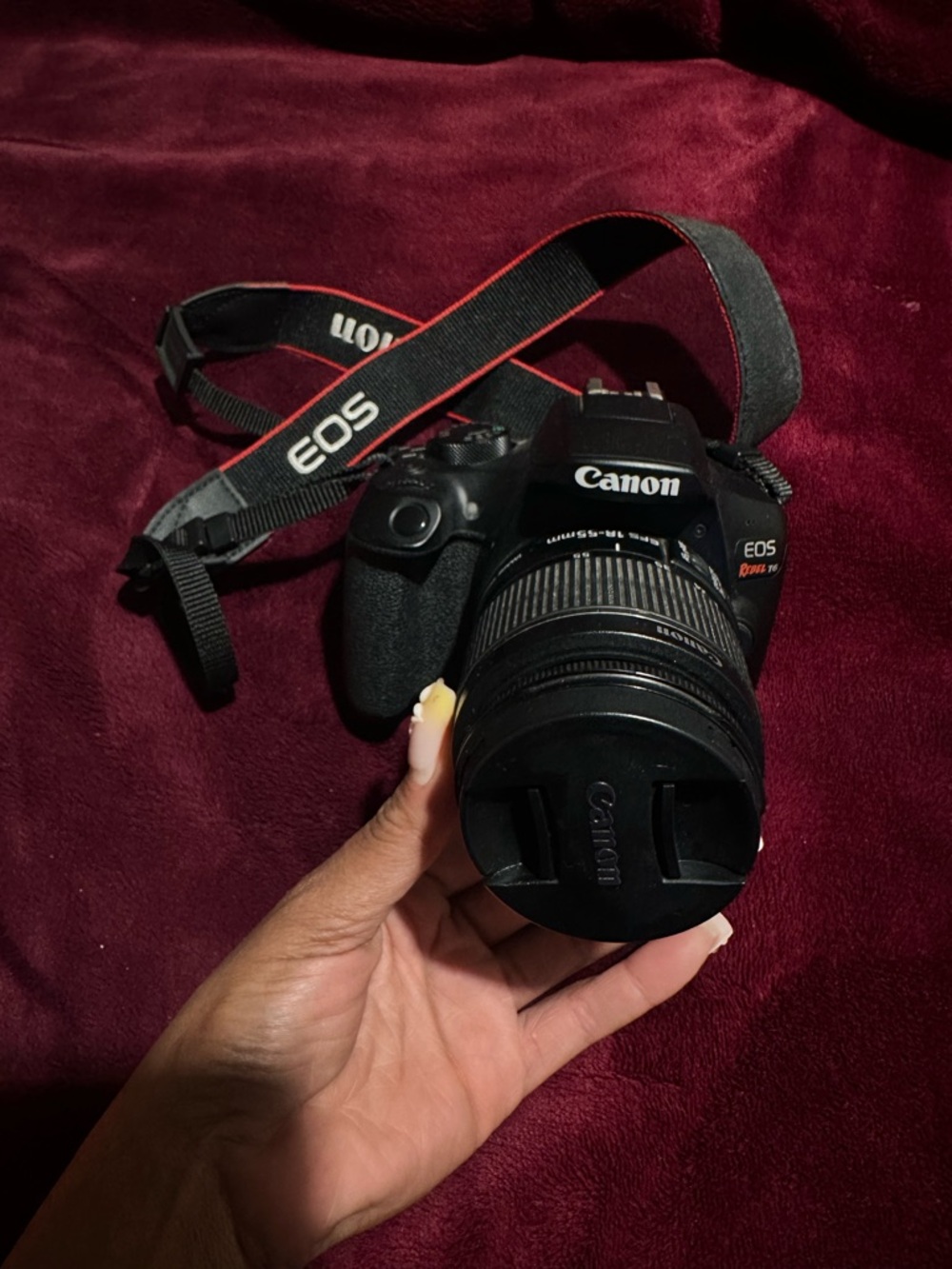 Canon EOS Rebel T6 Camera with Black Lens and Black Strap